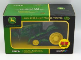 A boxed Britains John Deere 8430T tracked tractor,