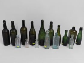 Seven 19thC. glass wine bottles twinned with a G.