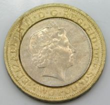 A two pound coin with offset wording