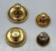 Four 9ct gold collar studs, one set with paste sto