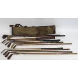 A selection of antique hickory golf clubs bag incl