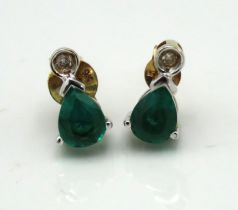 A pair of 9ct gold earrings set with emerald & sma