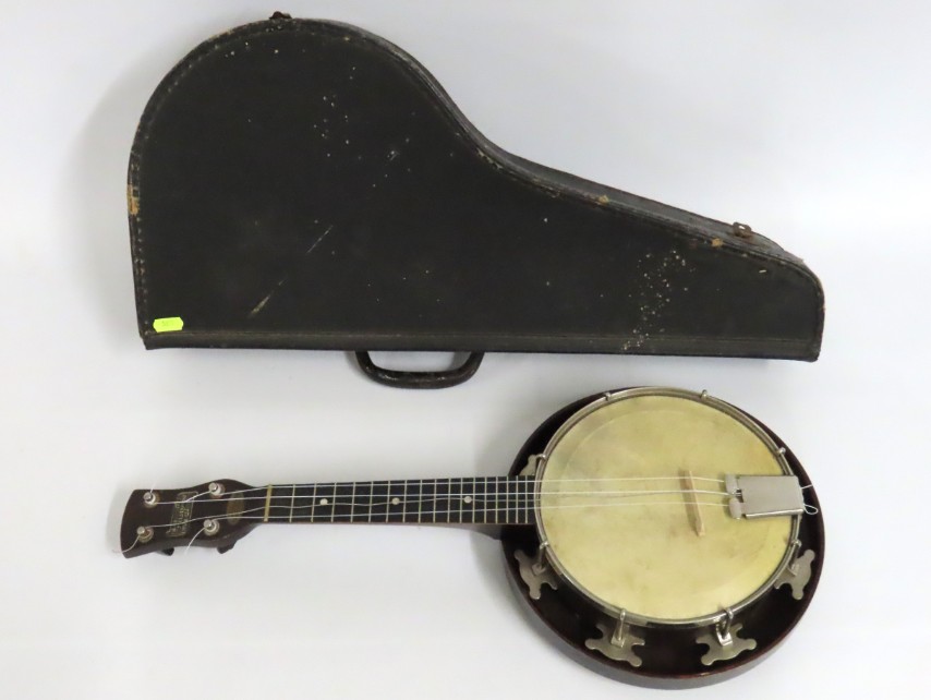 A 1930's Melody ukulele with case, 580mm long