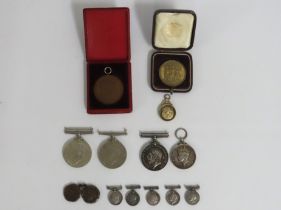 A cased Hong Kong 1902 Edward VII commemorative medal, a hallmarked silver masonic medal awarded to