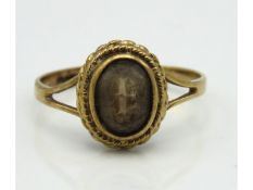 A 9ct gold ring set with smokey quartz, 1.9g, size