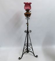 A rise & fall oil lamp with cranberry shade, 1600m