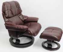 A Ekornes wine coloured Stressless recliner chair with stool