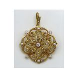 A 15ct gold antique ornate pendant set with diamond & pearl, 39mm wide x 29mm drop, lacking two pear