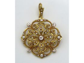 A 15ct gold antique ornate pendant set with diamond & pearl, 39mm wide x 29mm drop, lacking two pear