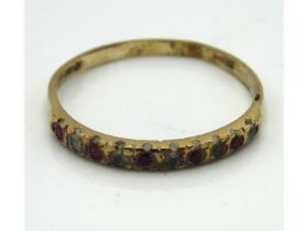 A 9ct gold half eternity ring set with ruby & whit