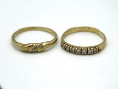 A 9ct gold half eternity ring set with white stones, size N, 1.8g twinned with one other 9ct gold ri