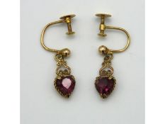 A pair of 9ct gold screw back earrings set with he