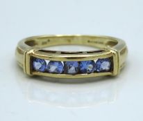 A 9ct gold ring set with five tanzanite stones, 2.