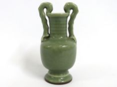 A 20thC. Chinese celadon vase, 145mm tall