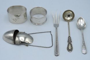 A 1911 Birmingham silver drip catcher by Hammond, Turner & Sons, a 1943 heavy gauge London silver na