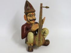 A 20thC. folk art carved wood & hand painted Asian