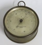 A brass cased Wilson, Worden & Co. barometer, 120m