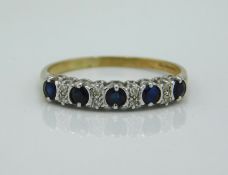 A 9ct gold ring set with diamond & sapphire, 1.4g,