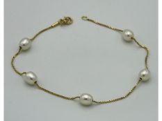 An 18ct gold bracelet set with pearl a/f, 200mm lo