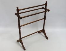 A Victorian walnut towel rail, 865mm high