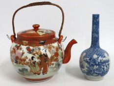 An Oriental teapot twinned with an Oriental bottle