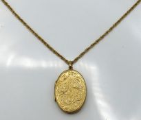 A 9ct gold locket & chain, locket 46mm drop, chain
