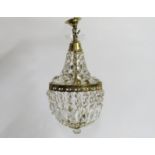 A decorative brass mounted crystal lamp shade, 420