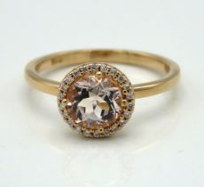 An 18ct rose gold halo ring set with diamond & mor