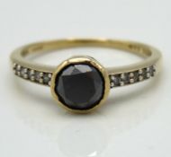 A 10ct gold ring set with approx. 0.75ct black diam
