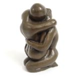 A bronze resin erotica model of entwined lovers, 1