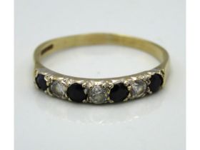 A 9ct gold half eternity ring set with sapphire &