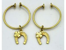 A pair of 14ct gold earrings with horseshoe & four