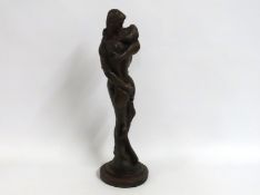 An unsigned contemporary bronze depicting two love