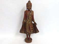 A large, decorative Standing Buddha, hand painted
