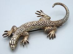 A silver lizard brooch with red stone eyes, 20.4g,