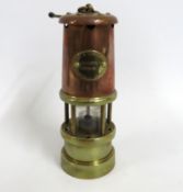 A Lamp & Limelight Co. brass & copper miners lamp,