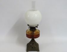 A Young's oil lamp with amber well & opaline shade