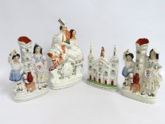 A pair of 19thC. Staffordshire spills, one with fa
