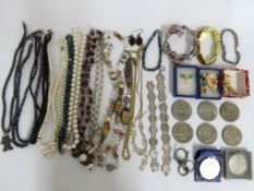 A quantity of costume jewellery, coin bracelets &