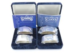 Two pairs of cased Carrs of Sheffield, silver napkin rings, dating to 1996 & 1997 respectively, 135g