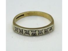 A 9ct gold half eternity ring set with seven small