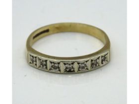 A 9ct gold half eternity ring set with seven small