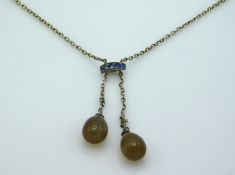 A 1920's .800 silver pendulum necklace with agate style stones