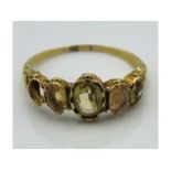 A yellow metal antique ring set with citrine, test