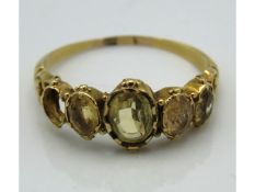 A yellow metal antique ring set with citrine, test