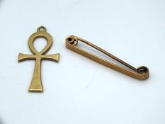 A 9ct gold Ankh twinned with a 9ct gold bar brooch