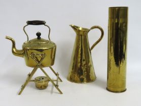 A brass spirit kettle, a brass jug & a trench art