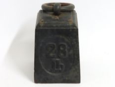 A 28lb cast iron door stop with ring, 255mm high i