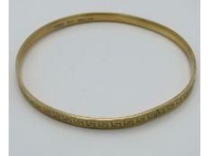 A 9ct gold metal core bangle, 17.4g inclusive, 79m