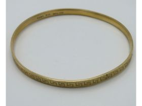 A 9ct gold metal core bangle, 17.4g inclusive, 79m